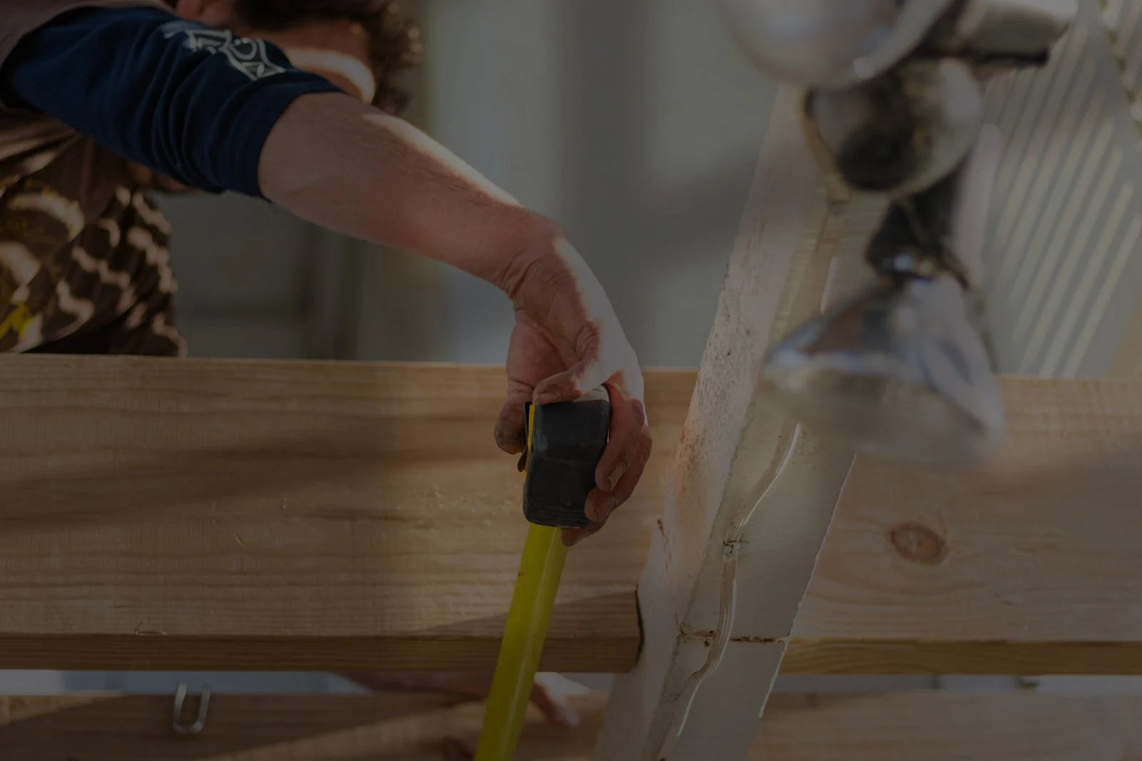 Evolve Outdoors installer preparing materials for an outdoor project