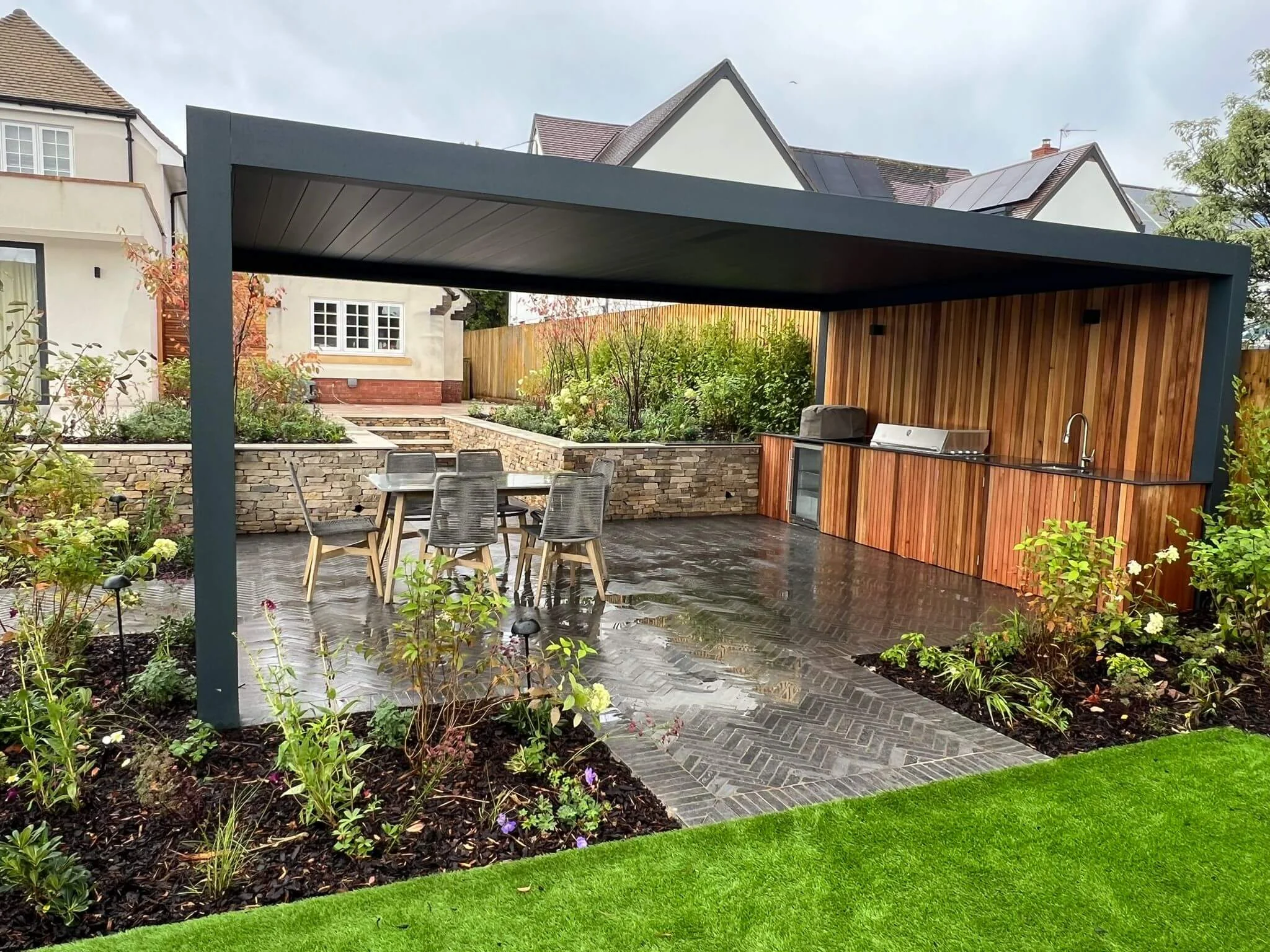 Bioclimatic pergola covering a modern garden seating area